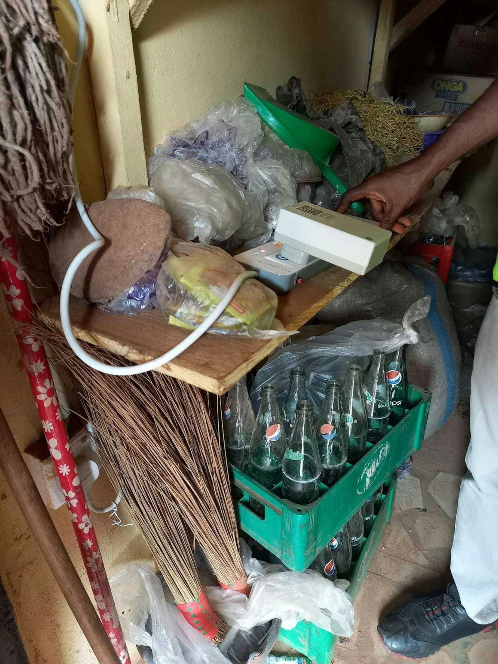 Photos of GridWatch sensors installed in homes and business. Top and bottom: Sensors in shops in Aria New Market, Enugu State, Nigeria. Sensors are collecting baseline measurements on the state of power in select markets across the country. (Photo Credit: Deborah Braide).